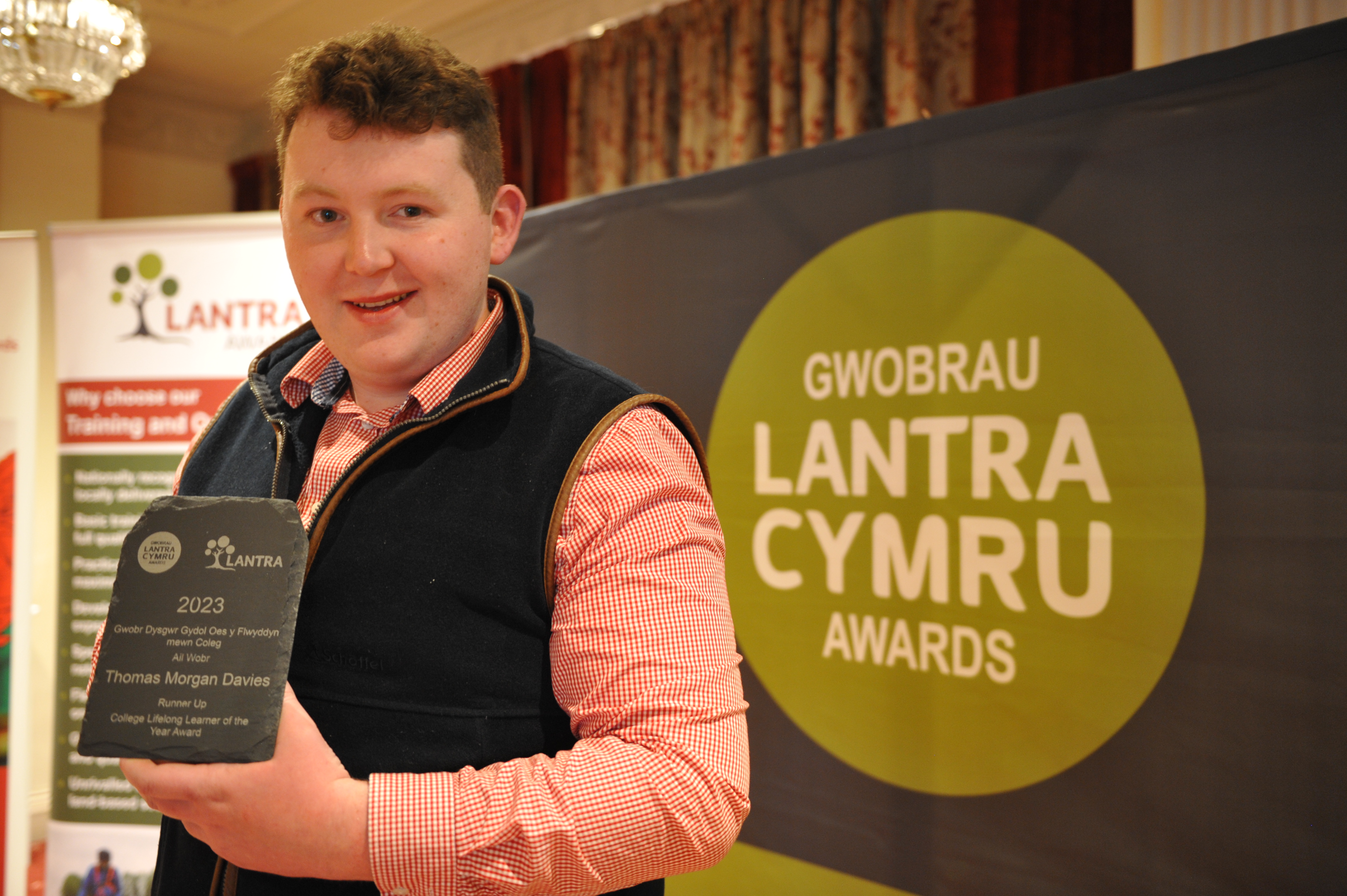 Cymru Awards Winner holding Award